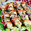 Souvlaki chick'n skewers over salad